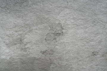Grey black slate stone background or texture