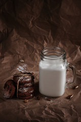 american cookies with chocolate and milk on a brown background