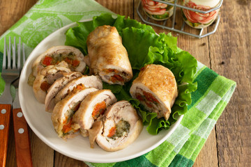 Festive appetizer. Chicken meatloaf with dried apricots, mozzarella and herbs on a festive table.