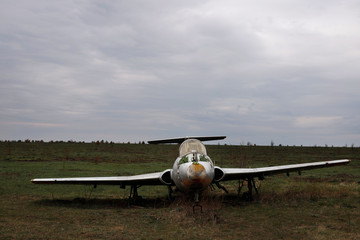 destroyed lonely soviet plane in the field