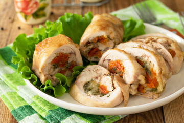 Festive appetizer. Chicken meatloaf with dried apricots, mozzarella and herbs on a festive table.