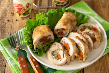 Festive appetizer. Chicken meatloaf with dried apricots, mozzarella and herbs on a festive table.