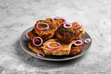 Pork fillet mignon roasted on cast iron pan, served with red onion and dill
