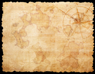 Old compass on paper background