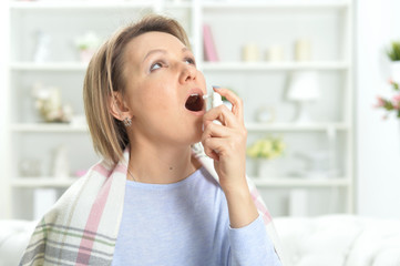 Portrait of beautiful young woman with sore throat