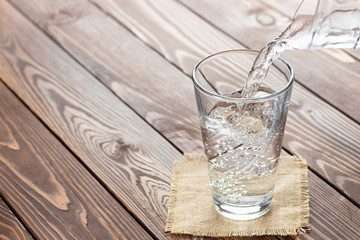 water pouring from jug into glass