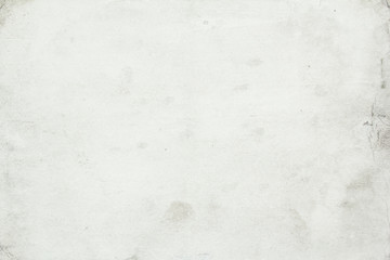Grey dirty paper with spots and stains texture background.