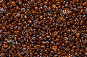 Obraz premium Roasted coffee beans closeup background.