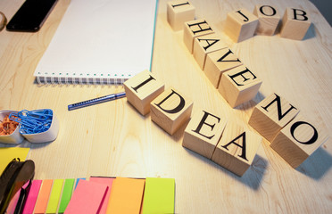 I have no idea, with wooden cubes on the office desk. Notebook pen and other stationery objects on the table.