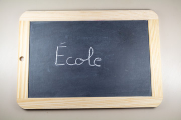Chalkboard slate with school written in french language