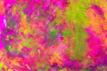 Pink background with green and yellow stains. Texture of living materials on paper. Bright gouache colors spread in abstraction. Stock illustration for creating a cover, wallpapers, design.