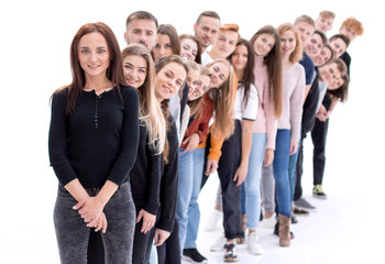 confident guy standing first in the column of young people © ASDF