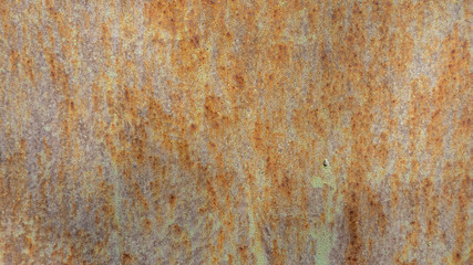 The texture of old metal, coated with paint and rust.