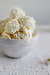 White ice cream on the white table and in front of white background
