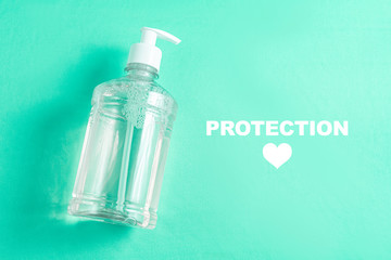 Container with alcohol gel on the light blue background