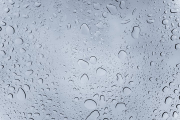 Raindrops on the window during storm, Europe