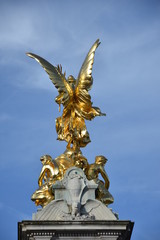 Fototapeta na wymiar Gilded Winged Victory at the top of the Victoria Memorial, London.