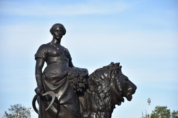 Progress, one of four bronze statues around the memorial the Victoria Memorial is a monument to Queen Victoria, located at the end of The Mall in London.