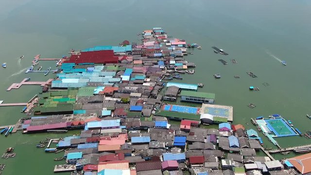 Drone backwards shot of Aerial view over Ko Panyi floating village in south of Thailand. Ko Panyi is a fishing and muslim village in Phang Nga Province.
