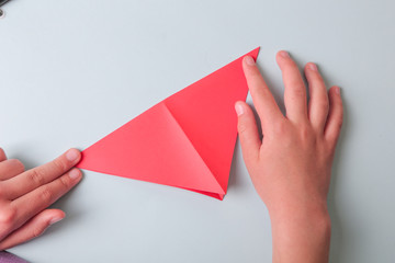 Step by step photo instruction. How to make origami paper fish. DIY for children. Children's art project craft for kids