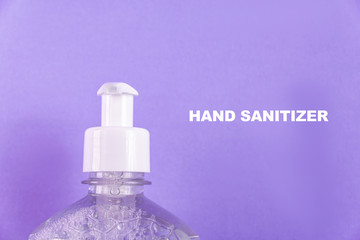 Container with alcohol gel on the light blue background