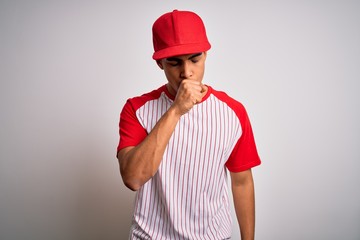 Young handsome african american sportsman wearing striped baseball t-shirt and cap feeling unwell and coughing as symptom for cold or bronchitis. Health care concept.