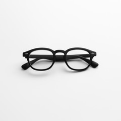 Straight closeup view of modern black eyeglasses on flat white background isolated