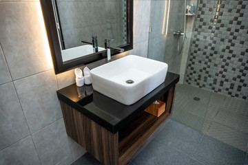 The photo of a white clean sink with the crane