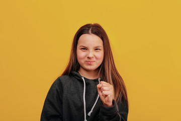 Happy girl wrinkled his face in a grimace.