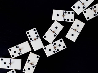 Domino tiles on black background
