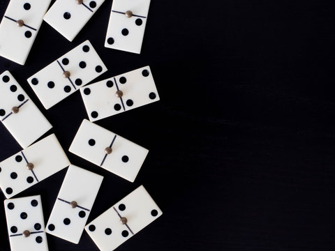 Black Dominoes game block in a row on a colored background Stock Photo -  Alamy