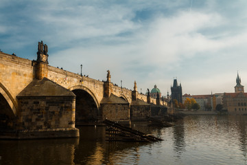 View of the Charles Bridge and the Vltava River in Prague in the fall. autumn.