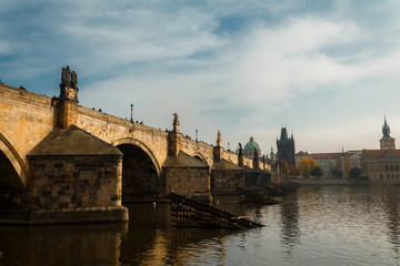 View of the Charles Bridge and the Vltava River in Prague in the fall. autumn.