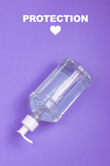 Container with alcohol gel on the light blue background