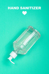 Container with alcohol gel on the light blue background