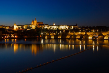 Fototapeta premium Prague Castle and Charles Bridge in night illumination, panoramic view of Prague.