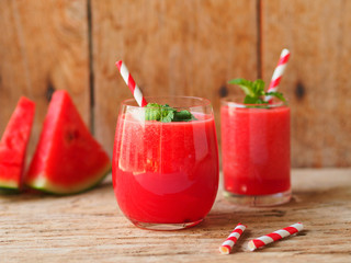 Watermelon juice on the wooden table for refreshment and summer drinks concept.