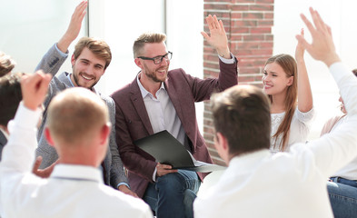corporate team votes during a business meeting.