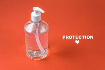 Container with alcohol gel on the red background