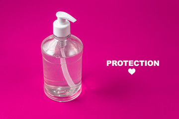 Container with alcohol gel on the red background