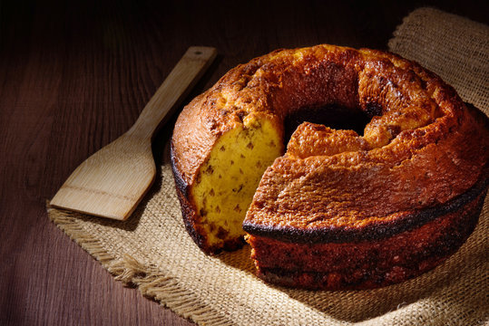 Delicious homemade cake, called anthill cake or with chocolate chips, Brazilian confectionery on a wooden table
