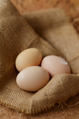 3 eggs on the burlap background