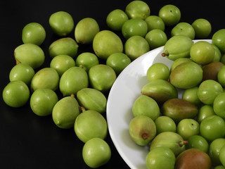 close-up shooting raw nectarine and sour plum,first sour fruits in spring,
