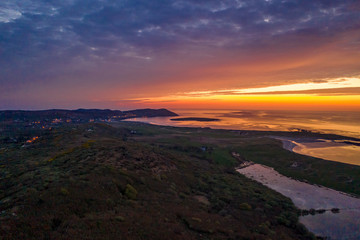 Fototapeta premium Aerial of sunset above Clooney, Narin and Portnoo in County Donegal - Ireland.