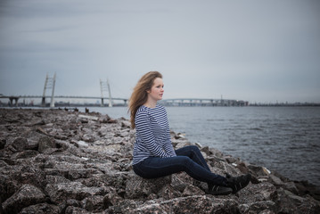 girl on the rocks on the beach