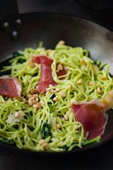 Pasta with jamon, spinach and pine nuts.