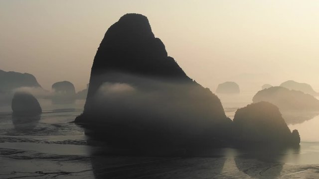 Drone shot of Aerial view of Samet Nangshe with sunrise in Phang nga. slow motion movement of camera. Close up.