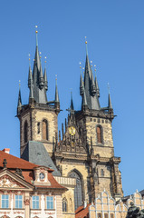 Fototapeta na wymiar Historical buildings in the old town with the front side of the Church of Our Lady before Tyn in Prague, Czech Republic. Old Town Square in Praha, Czechia. Tourist landmarks. Vertical photo.