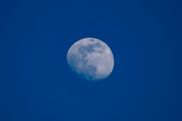 full moon over blue sky