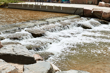 Closeup of cascading water on South Platte River at Confluence Park in Denver, Colorado.  